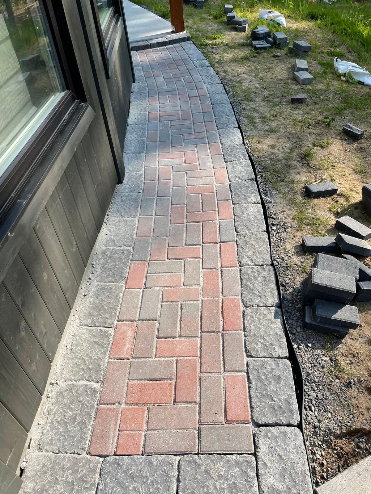 Interlocking brick walkway by Relica Comforts